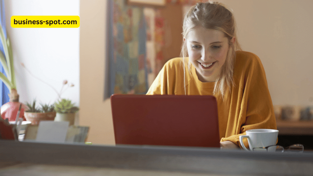 Students using AI tools on laptops and tablets in a modern classroom, promoting learner autonomy with the guidance of a teacher.