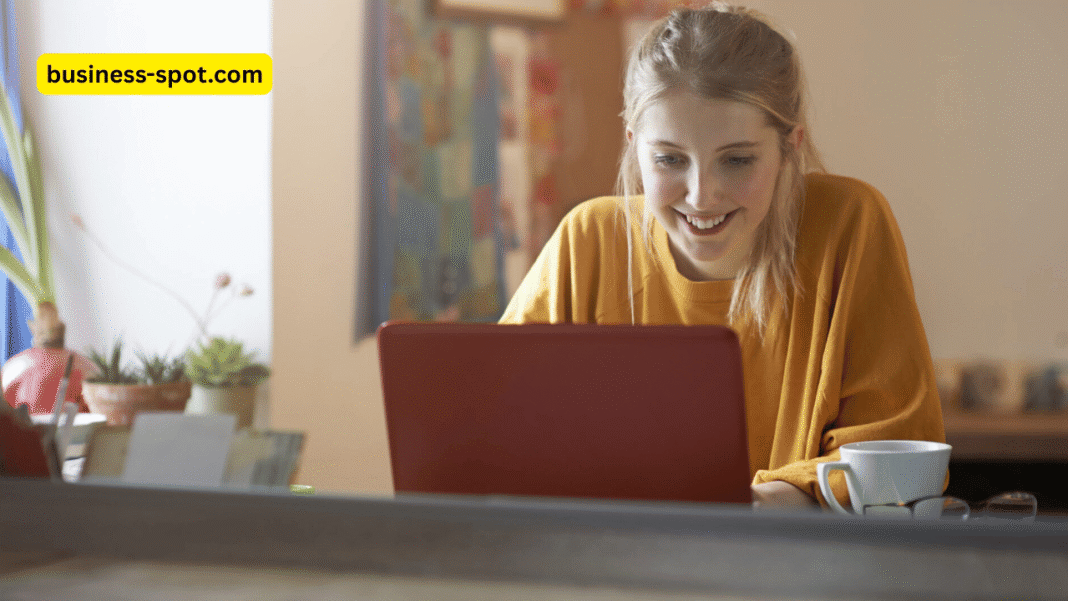 Students using AI tools on laptops and tablets in a modern classroom, promoting learner autonomy with the guidance of a teacher.