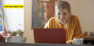 Students using AI tools on laptops and tablets in a modern classroom, promoting learner autonomy with the guidance of a teacher.
