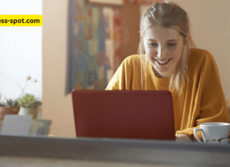 Students using AI tools on laptops and tablets in a modern classroom, promoting learner autonomy with the guidance of a teacher.