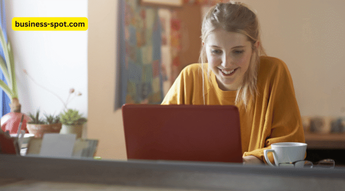 Students using AI tools on laptops and tablets in a modern classroom, promoting learner autonomy with the guidance of a teacher.